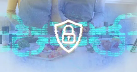 Couple slicing peppers as binary code scrolling activating lock-shield icon Stock Footage 319678279