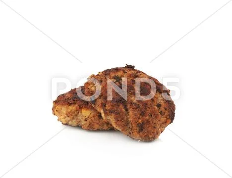 Couple of small hand made cutlets isolated over white background Stock Photos