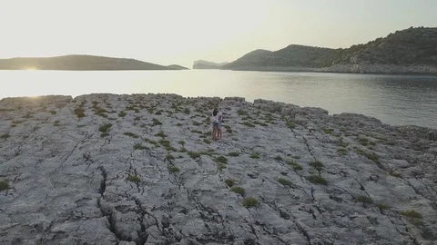 Couple on a small island at sunset 스톡 동영상 78598756