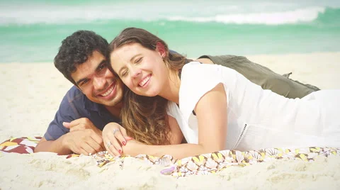 Couple smiles on a beach Video stock 49609383