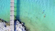 Couple Snorkeling In Clear Tropical Blue Water By Aerial Drone Stock Footage