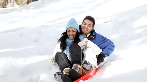Couple Snow Sledding Stock Footage 43357231