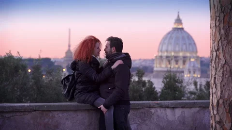 Couple snuggling and playing, sunset in Rome, public park Stock Footage 59354398