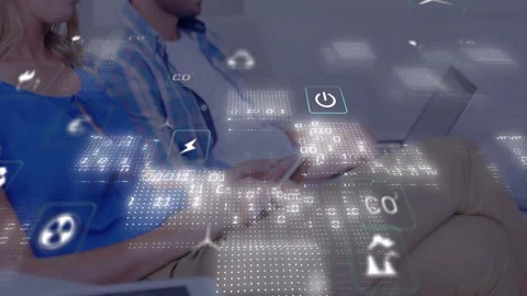 Couple on sofa casual wear tapping phone and typing laptop checking energy data, Stock Footage 334311565