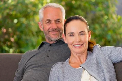 Couple on sofa Stock Photos