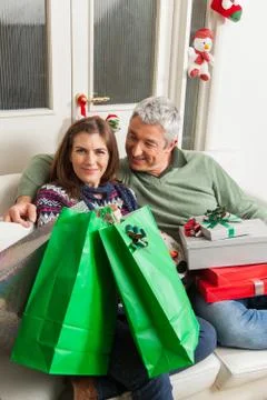 Couple in the sofa with presents 写真素材