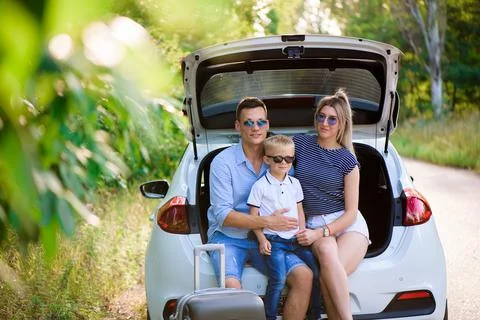 Couple with son having a coffee break while traveling in the countryside. A man Stock Photos