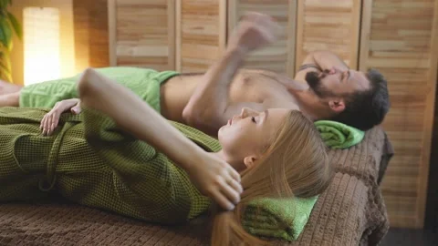 Couple in spa salon lying on bed going to receive massage. Stock Footage 150615709