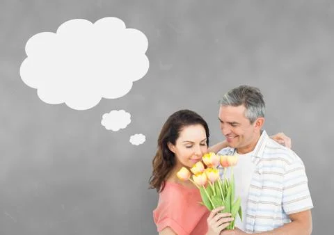 Couple with speech bubble thinking against grey background Stock Photos