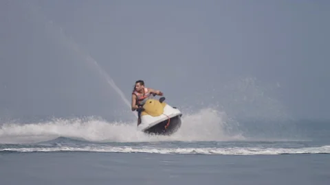 Couple speeding on jet ski. Stock Footage 119395949