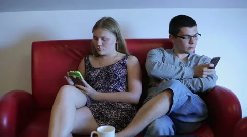 Couple is spending time together, sending sms Stock Footage 65052954