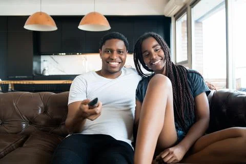 Couple spending time together while staying at home. Stock Photos