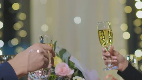 Couple spends evening time sitting in cafe say toast close-up 스톡 동영상 125783158