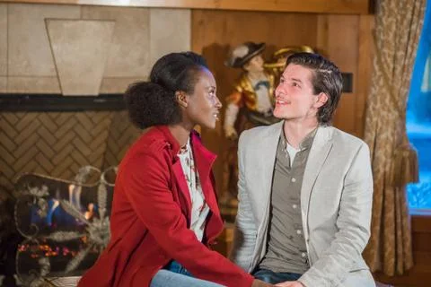 Couple Spends Time Together in Front of Fireplace Stock Photos