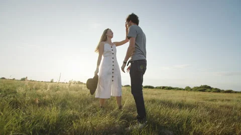 Couple spends vacation dancing and kissing against horizon Stock Footage 219953238