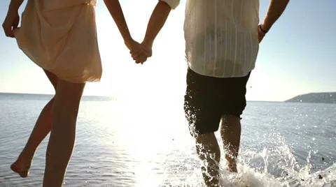 Couple Splashing Into Sea Video stock 33804010
