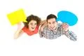 The couple stand with dialog signs. View from above Photo