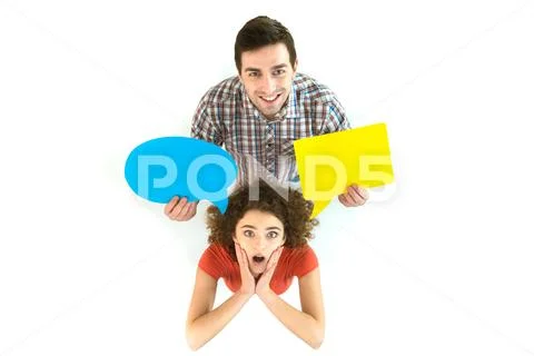 The couple stand near the dialog signs. View from above Stock Photos