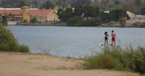 Couple Stand up paddleboarding Stock Footage 40038951