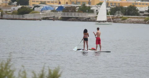 Couple stand up Paddleboarding Stock Footage 40039151