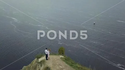 Couple standing against amazing nature view. Clip. Couple is standing on a Stock Photos
