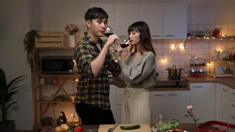 Couple standing and making toast with red wine Stock-Footage 168013582