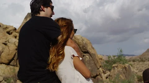 Couple standing around rocks Stock-Footage 62344803