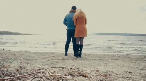 Couple Standing on a Beach and Talking Stock Footage 66422015