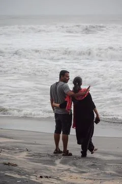 Couple standing at beach Stock Photos