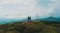 The couple standing on a beautiful mountain 4k or 4k+ Resolution