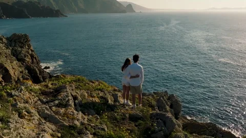 Couple Standing On Cliff Overlooking The Ocean On The Atlantic Coast Stock-Footage 252833668