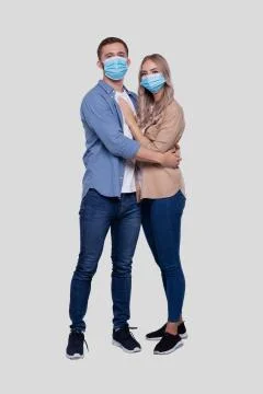 Couple Standing Hugging Looking Front Wearing Medical Mask Isolated. Man and Stock Photos