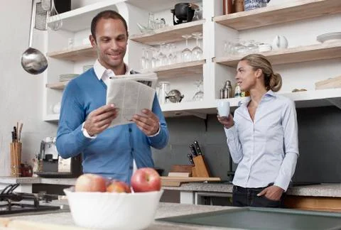 A couple standing in the kitchen Stock Photos