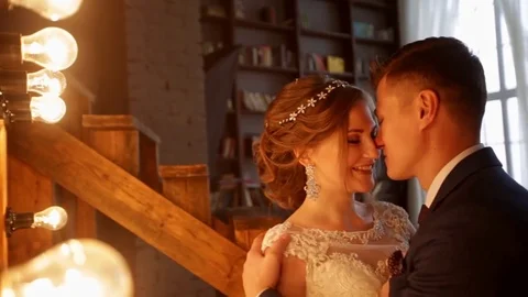 Couple standing in loft interior Stock Footage 69828075