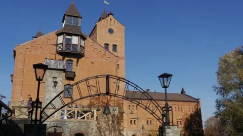 Couple is Standing Looking at Castle Yard Towers Arch With a Bells Red Brick Stock Footage 57982603