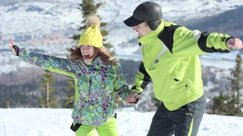 Couple standing in mountains in winter Stock Footage 73477863