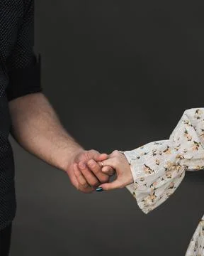 Couple standing side by side and holding Foto stock