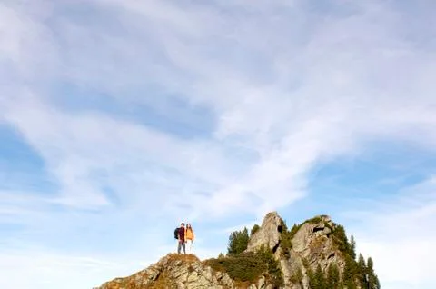 Couple standing on summit Stock Photos