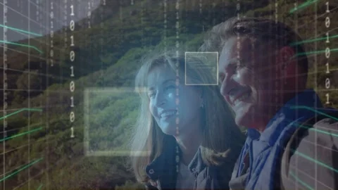 Couple standing sunlit-hill 3D grid fading in leading face boxes scanning binary Stock Footage 333317929
