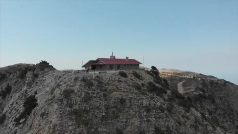A couple is standing on the top of the hill house on the deserted mountain Stock Footage 197800548