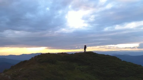 The couple standing on the top of a mountain Video stock 113732792