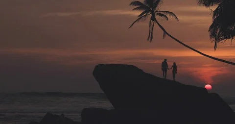 Couple standing on top of rock Stock Footage 108632976
