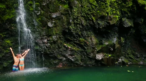 Couple Standing Under Waterfall Stock Footage 52994954