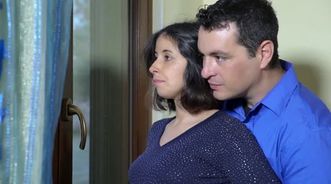 Couple stands at the window  Video stock 59100121