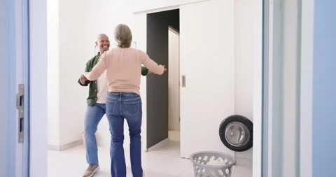 Couple starting dance after man lifting grey basket, taking hands while doing 스톡 동영상 336686463