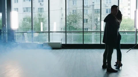 A couple starting to dance while the smokes begins to appear Stock Footage 107424297