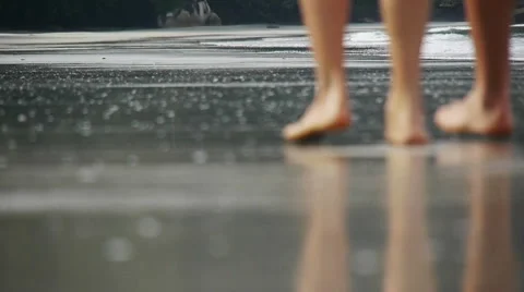 Couple steps on the beach reflected in water Stock Footage 60259831