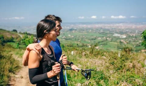 Couple stopping to look the views while doing trail Stock Photos
