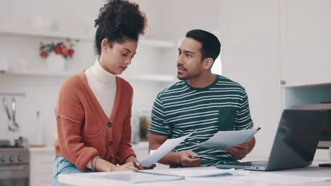 Couple, stress and debt documents, laptop and bills, rent payment and home Stock Footage 248594366