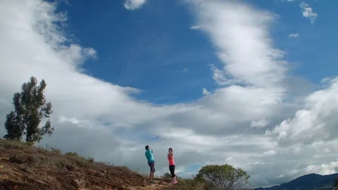 Couple stretching on the hills Видео 75167533